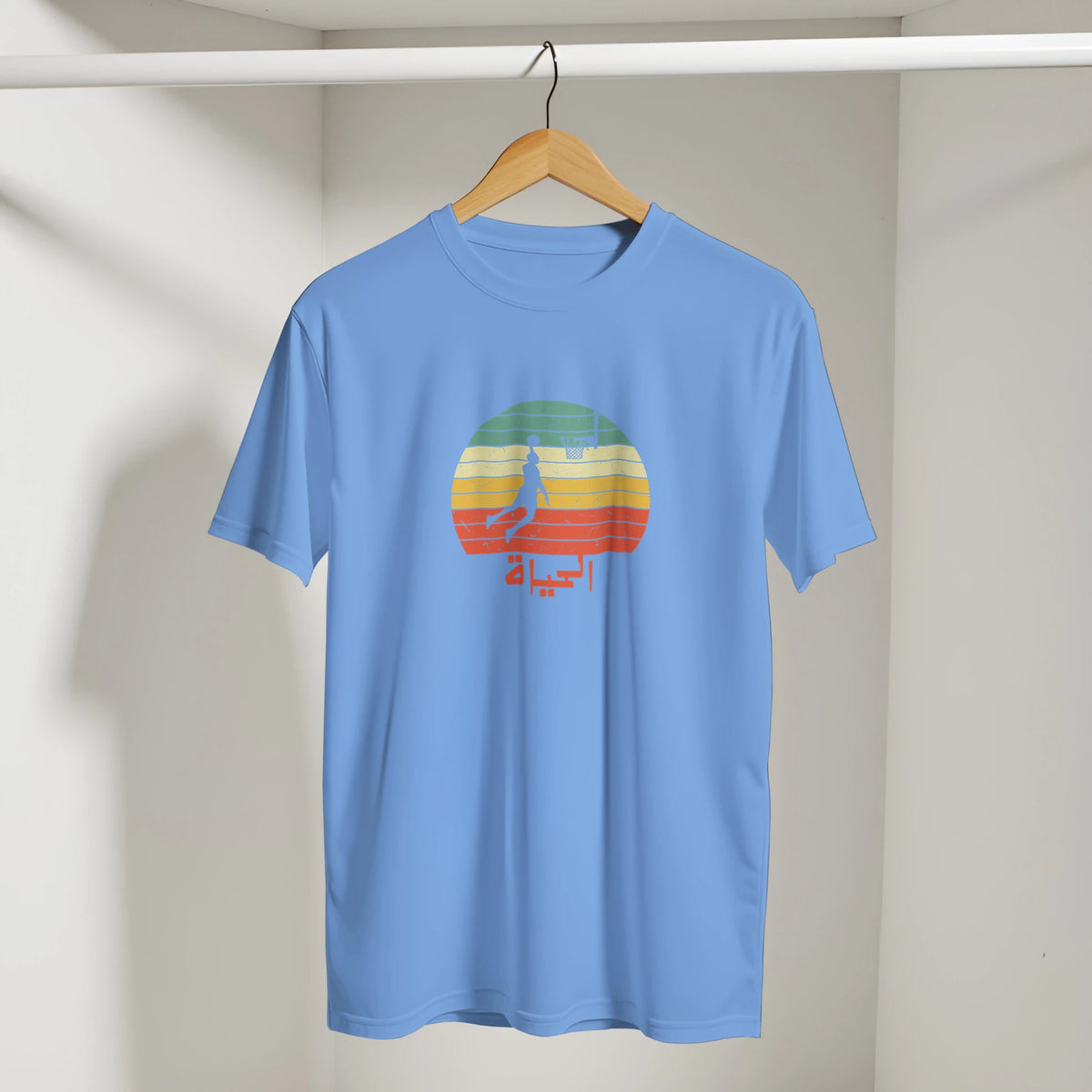 Eshta Retro Sunset Basketball Tee in Carolina Blue, Arabic graphic design by Cairo NYC